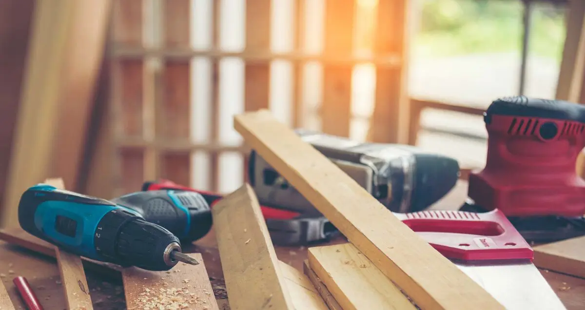 home building scene with drills and tools